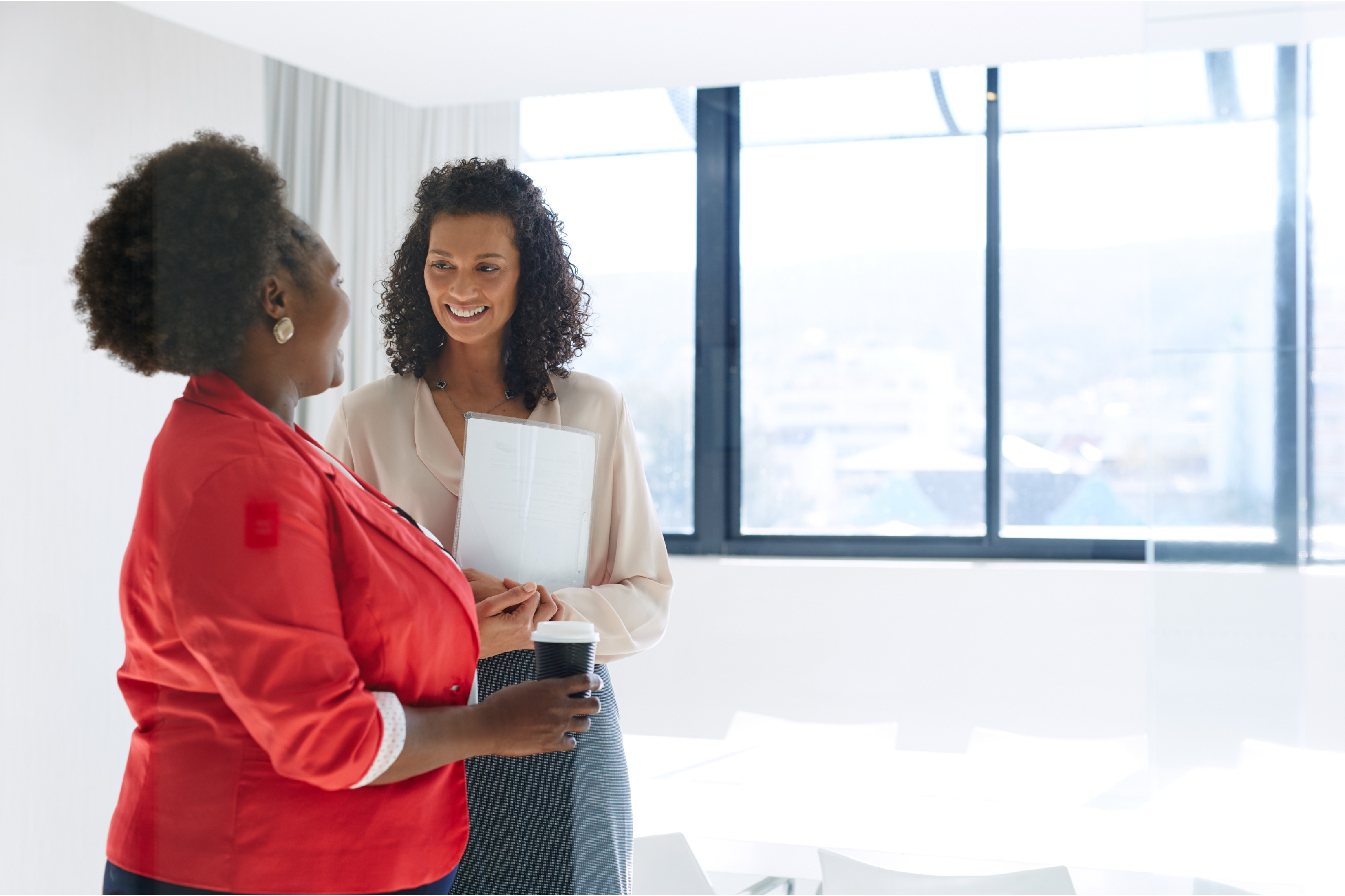 Two colleagues discussing in an office